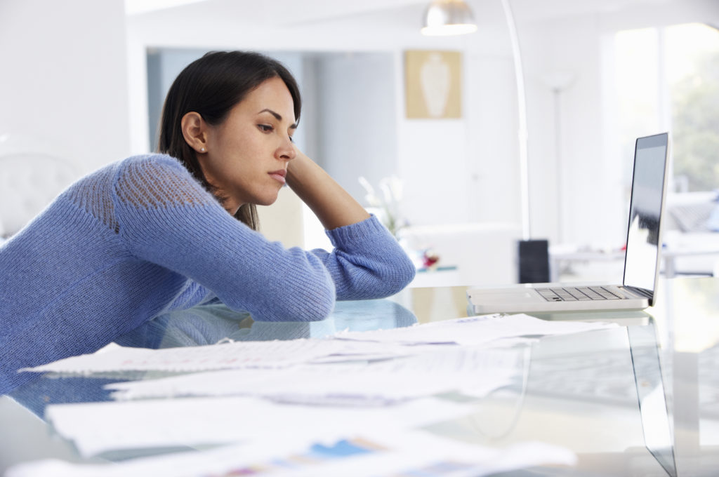 Stressed woman working remote